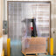 XPS Tech heavy-duty clear PVC strip curtain at a loading dock with forklift — 12 in × 0.120 in × 200 ft roll