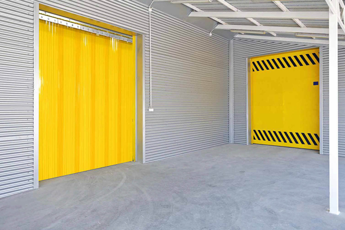 XPS Tech yellow anti-insect PVC strip curtain in a doorway — 0.080 in thick, 300 ft roll