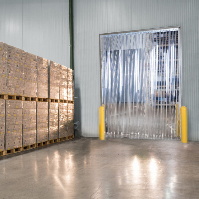 XPS Tech heavy-duty clear PVC strip curtains at a warehouse loading dock — 12 in × 0.120 in × 200 ft roll