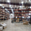 XPS Tech clear nylon-reinforced PVC strip curtain roll, 8 in × 0.080 in × 300 ft, in a warehouse interior