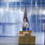 Worker moving a pallet through XPS Tech clear PVC strip curtains, 8 in × 0.080 in × 300 ft roll